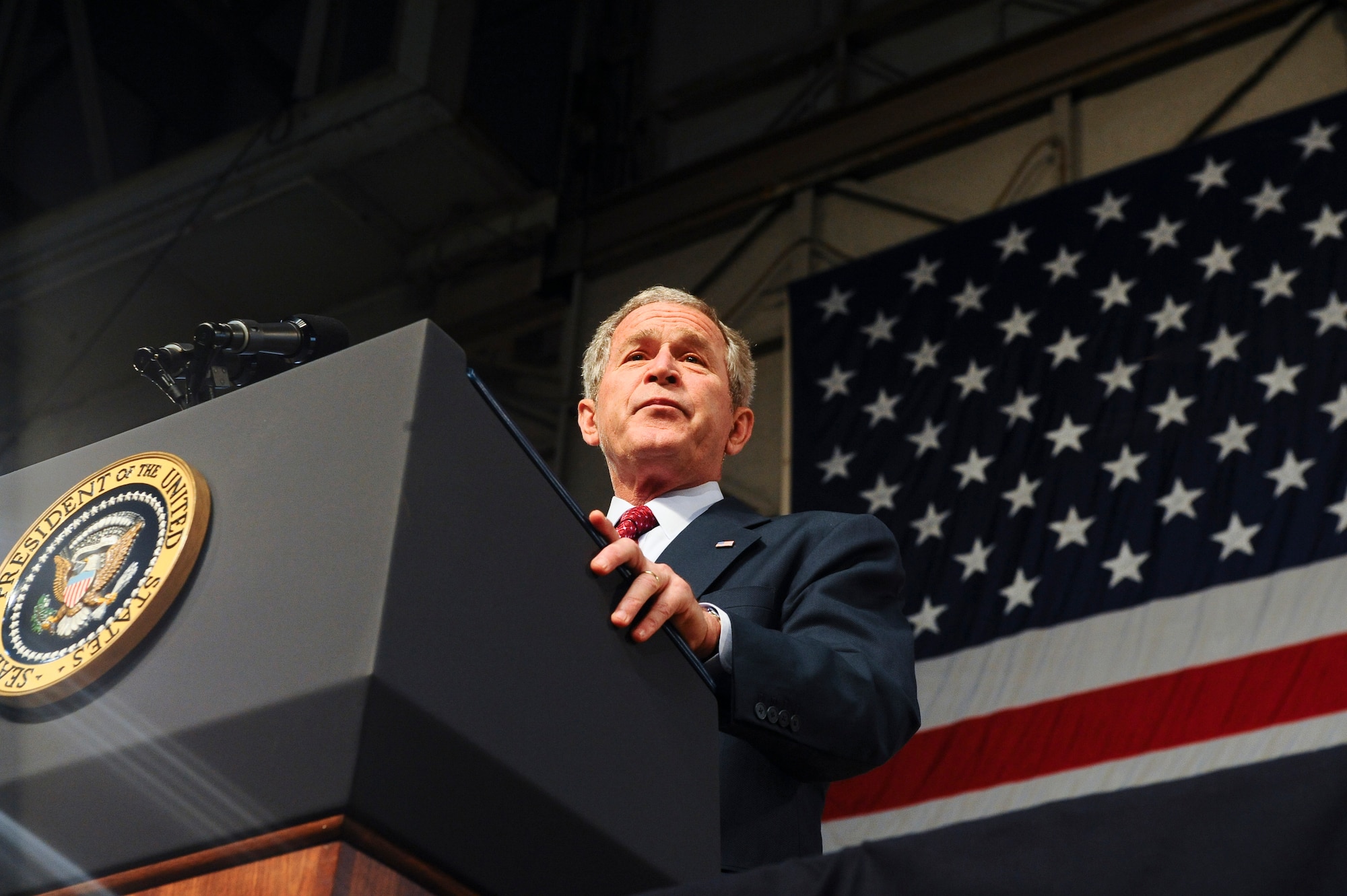 President George W. Bush looks out into the crowd while giving his speech August 4, 2008 at Eielson Air Force Base, Alaska. The President made a short stop at Eielson during his trip to the 2008 Olympic Games being held at Beijing, China. During his time here he had a chance to talk to a crowd of over 2,000 military personnel and taking the time to shake hands and thank them for their service. (U.S. Air Force photo by Airman 1st Class Jonathan Snyder)