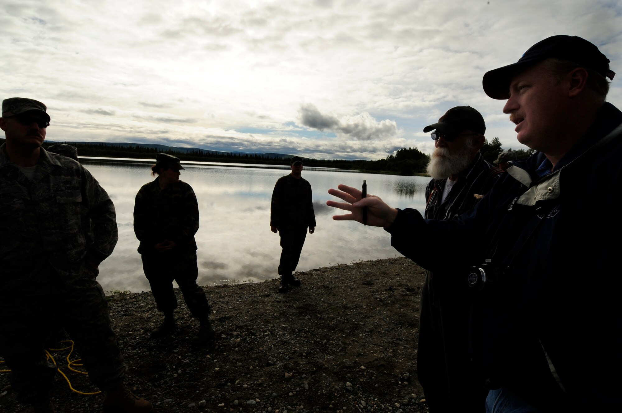 Spectra Tech corporation Senior Analyst Mr. Tracy Taylor briefs members of the 35th Civil Engineer Sqaudron on the results of the simulated oil spill exercise July 23, 2008 at Eielson Air Force Base, Alaska . This exercise is an annual requirement based on the Oil Pollution Act of 1990. (U.S Air Force Photo by Tech Sgt Eric T. Sheler)