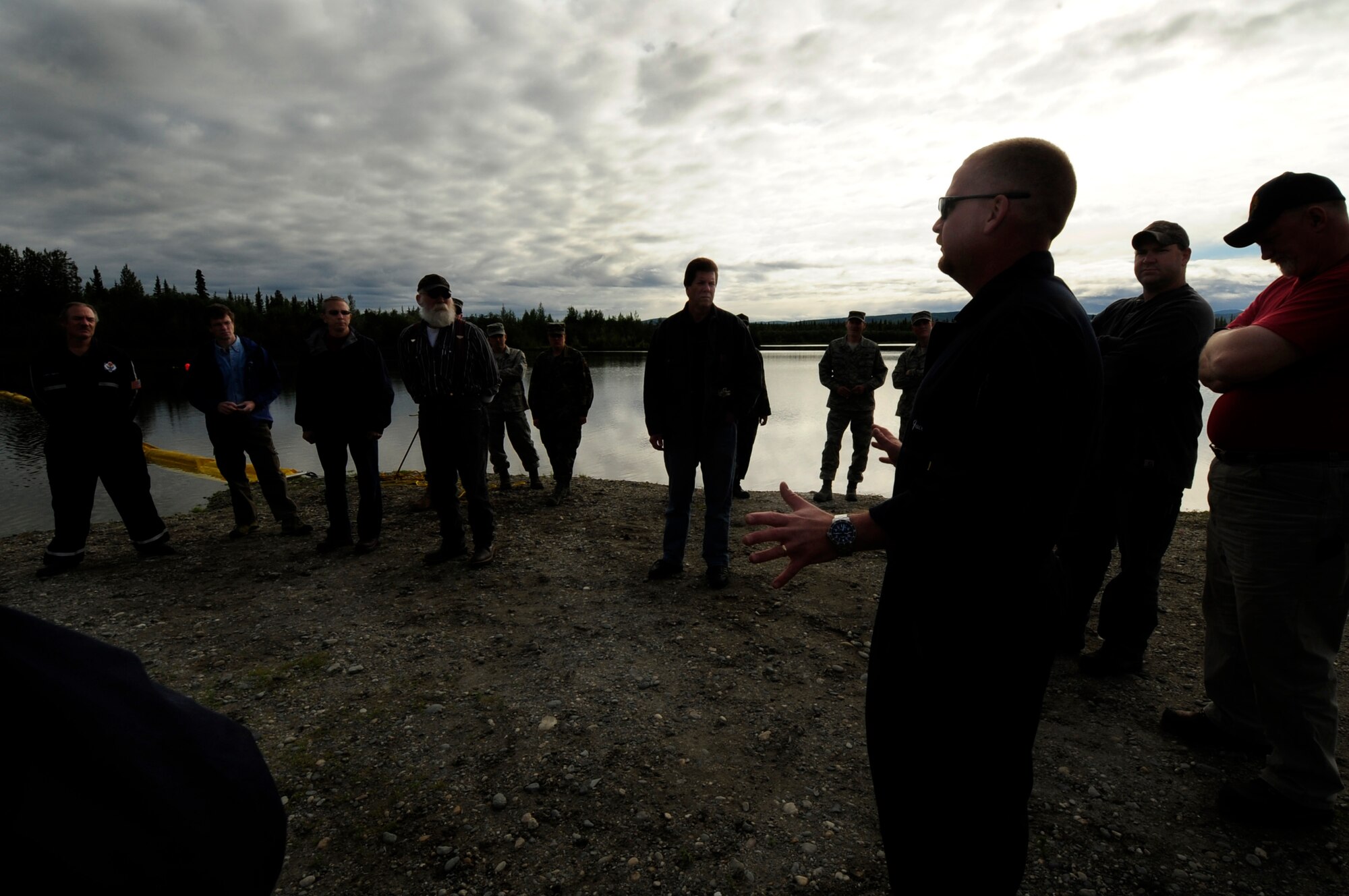 Mr. Jace Johnson, a U.S Navy Supervisor of Salvage briefs members of the 35th Civil Engineer Sqaudron on the results of the simulated oil spill exercise July 23, 2008 at Eielson Air Force Base, Alaska . This exercise is an annual requirement based on the Oil Pollution Act of 1990. (U.S Air Force Photo by Tech Sgt Eric T. Sheler)