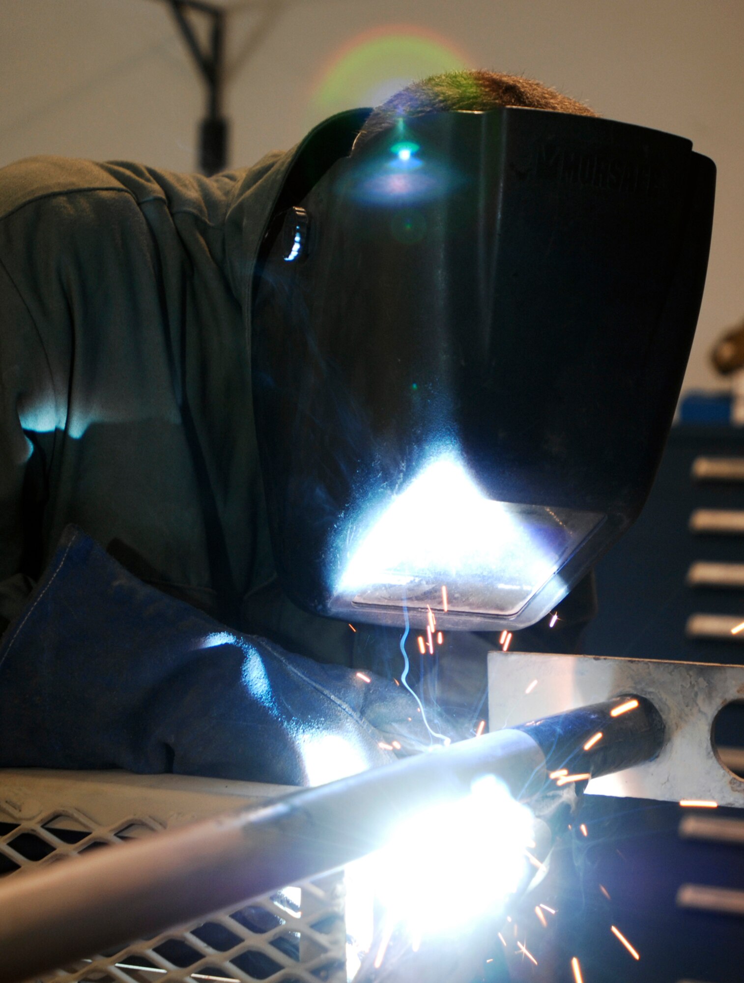 JOINT BASE BALAD, Iraq -- Senior Airman Joseph Krafchak uses an arc welder to repair an aircraft maintenance stand here Aug. 2. Aircraft maintainers use the stands to perform maintenance on F-16 Fighting Falcons. Airman Krafshak, a metals technician journeyman with the 332nd Expeditionary Maintenance Squadron here, is deployed from Shaw Air Force Base, S.C. His hometown is Lompoc, Calif. (U.S. Air Force photo/Airman 1st Class Jason Epley)