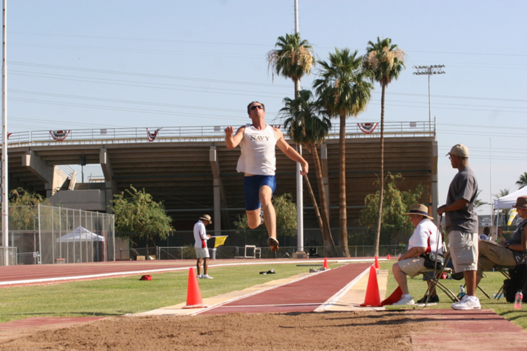 Navy Petty Officer 1st Class Casey Tibbs makes a qualifying long jump June 14 during the 2008 U.S. Paralympic Trials held in Tempe, Ariz. The U.S. Paralympic Track and Field and Swim teams will visit Kadena Aug. 24 to train and get acclimated to the weather just before heading to China to compete in the 2008 Paralympic Games.  (U.S. Olympic Committee photo/Jeannine Hansen)