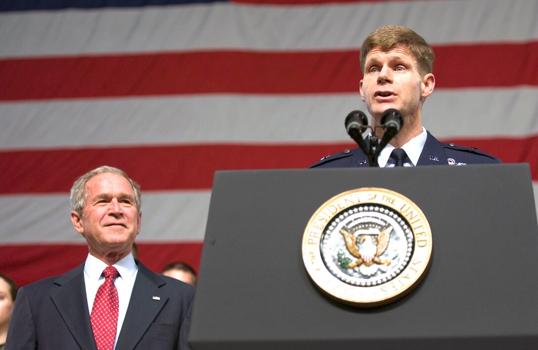 U.S. Air Force Brig. Gen. Mark Graper, right, commander of 354th Fighter Wing, introduces President George W. Bush to the audience on Eielson Air Force Base, Alaska, Aug. 4, 2008. 