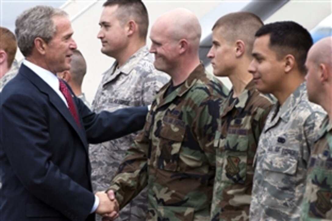President George W. Bush speaks with U.S. Air Force Airman Christopher Coon of the 354th Logistic Readiness Squadron on Eielson Air Force Base, Alaska, Aug. 4, 2008. 
