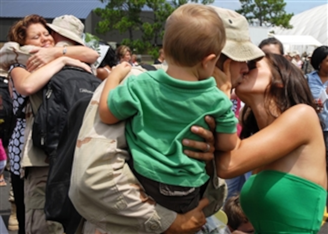 U.S. Navy Seabees from Naval Mobile Construction Battalion 74 are greeted by their families as they return to Naval Construction Battalion Center Gulfport, Miss., on Aug. 4, 2008, following a six-month deployment.  