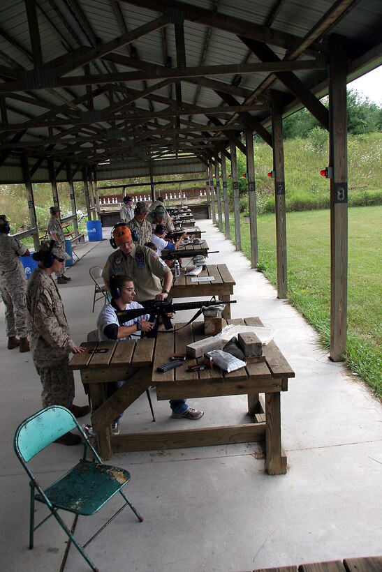 Poolees from Marine Corps Recruiting Station Milwaukee fire the AR-15 rifle during a familiarization rifle range August 4-7 at the Stone Bank Sportsman's Club in Oconomowoc, Wis.  This pool function allowed poolees to learn about the AR-15, the civilian version of the M-16 A2 service rifle, to include weapons safety, weapons handling, trigger control, breath control and to become familiar with a weapon similar to what they will be firing in boot camp.