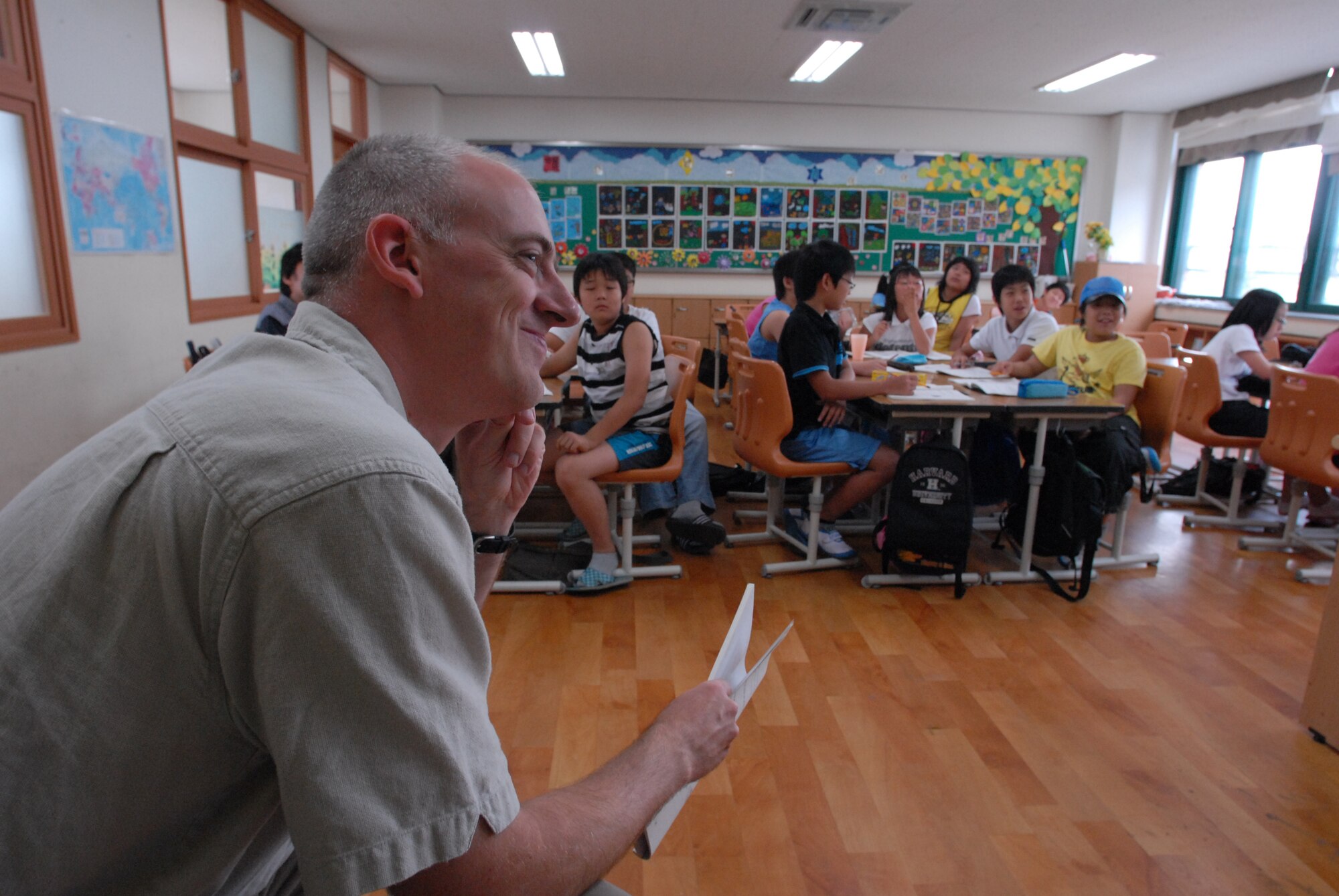 KUNSAN AIR BASE, Republic of Korea— Major Gerald Braley,8th Medical Operations Squadron, enjoys the lesson taught during the Kunsan-Sponsored English Camp at the Jinp'yo Elementary School, Gunsan City July 30. 15 Airmen Volunteered to help teach More Than 60 elementary and middle grade Korean students that participated in the English Camp.(US Air Force Photo By: Senior Airmen Angela Ruiz)