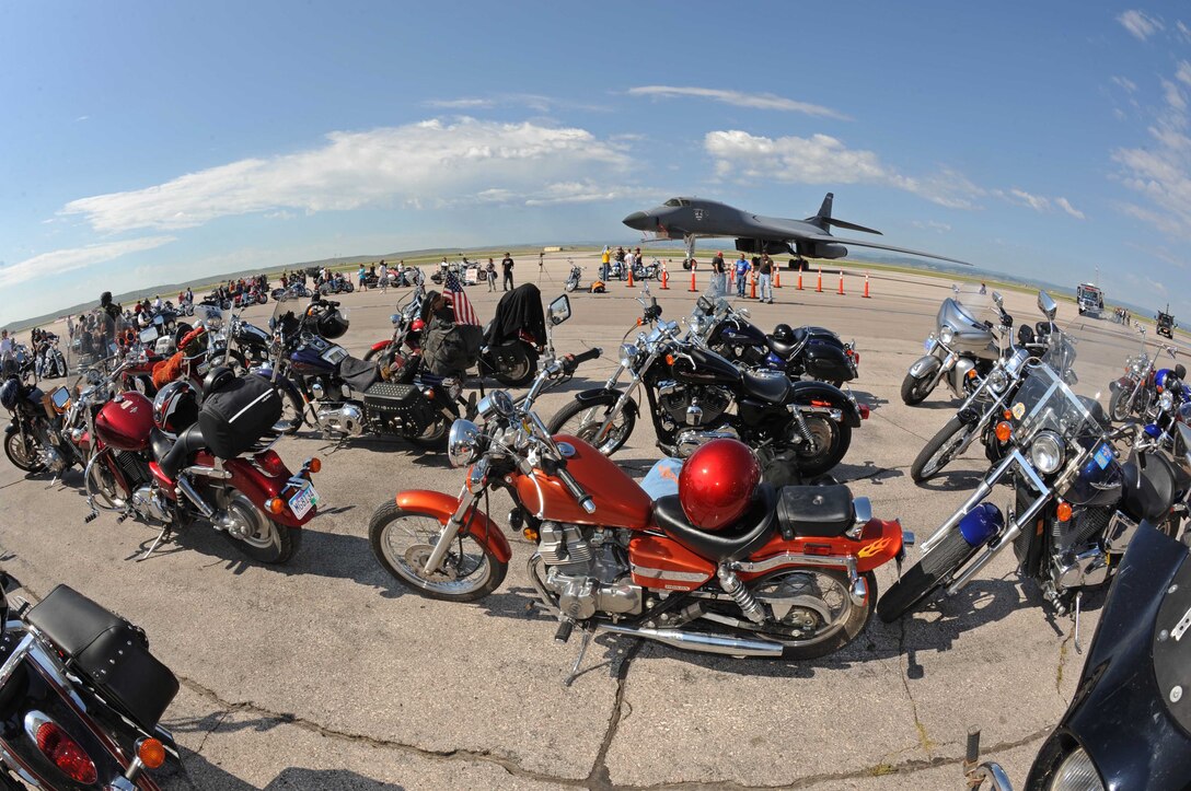 Nearly 450 motorcycle riders await a B-1B Lancer's takeoff at Ellsworth, Aug. 5. The flyover is the signal to begin the Dakota Thunder Motorcycle Run from Ellsworth to the 68th Annual Sturgis Motorcycle Rally. (U.S. Air Force photo/Airman Corey Hook)