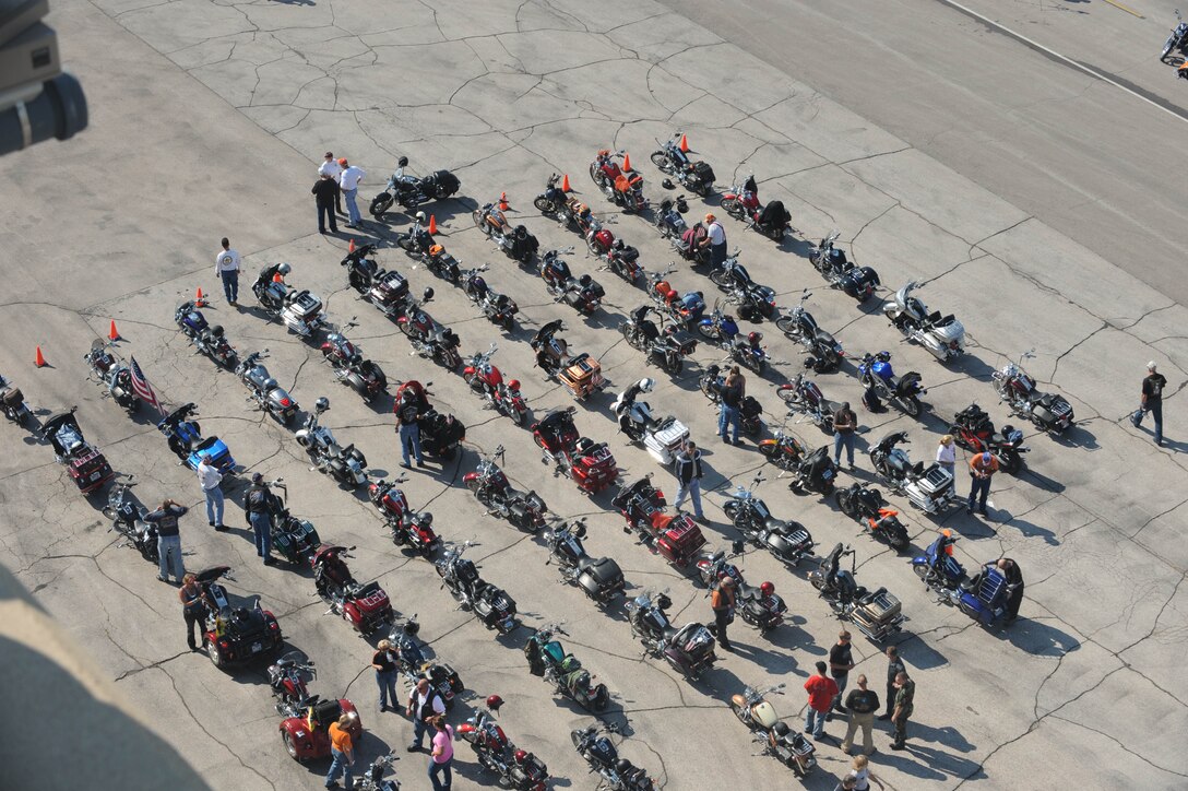 The Dakota Thunder Motorcycle Club hosted nearly 450 riders from around the United States during the annual Dakota Thunder Motorcycle Run from Ellsworth to the 68th Annual Sturgis Motorcycle Rally, Aug. 5. Members of the motorcycle club had the opportunity to view and have photos taken in front of a static display of a B-1 here before the ride to Sturgis, S.D. (U.S. Air Force photo/Airman 1st Class Adam Grant)