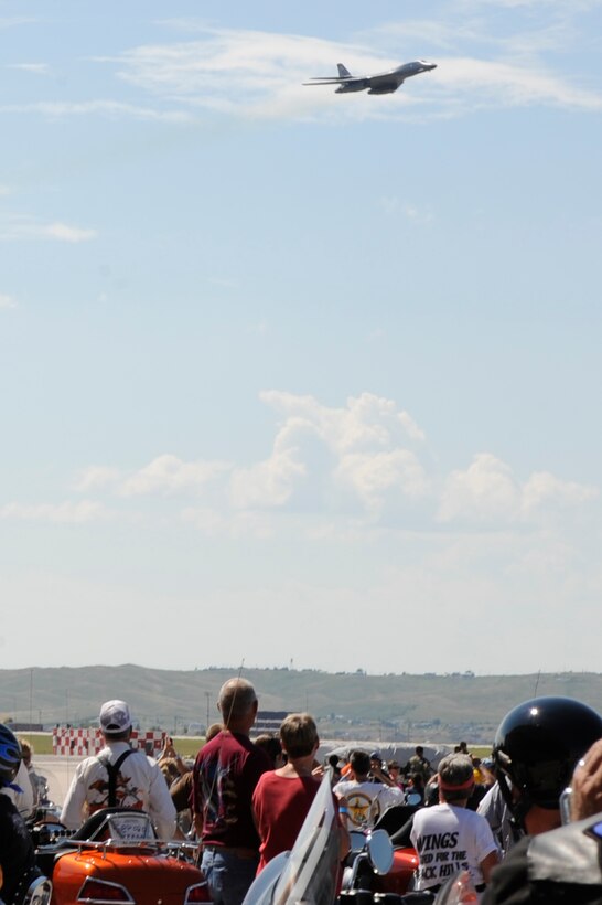 ELLSWORTH AIR FORCE BASE, S.D. -- Participants of the Eighth Annual Dakota Thunder Motorcycle Run watch a B-1B Lancer perform a flyover, Aug. 5. Nearly 450 riders from across the country participated in the ride from Ellsworth Air Force Base to the 68th annual Sturgis Motorcycle Rally. (U.S. Air Force photo by Airman Matthew Flynn)

