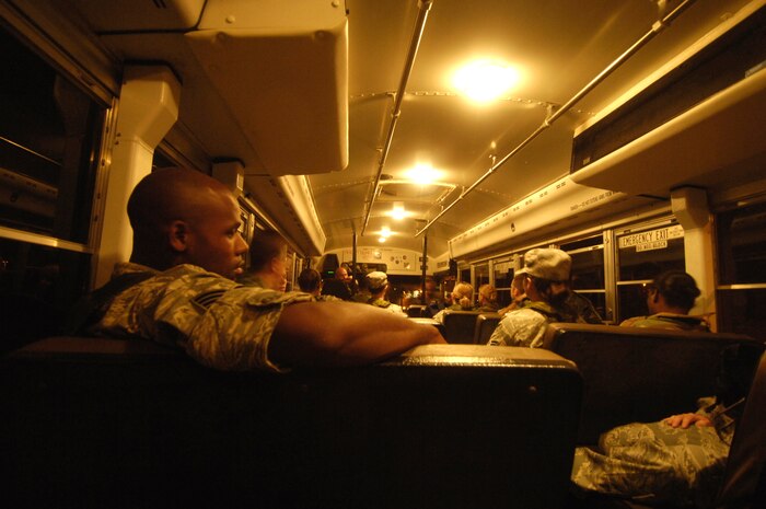 Team Charleston Airmen are loaded onto a bus to process through the deployment line at Charleston AFB during the Headquarters Air Mobility Command Operational Readiness Inspection Aug. 5. Headquarters inspectors are evaluating the 437th and 315th Airlift Wings' capability to generate aircraft, deploy Airmen and cargo and employ from a forward location in support of global military operations. (U.S. Air Force photo/Staff Sgt. Dennis Henry Jr.)