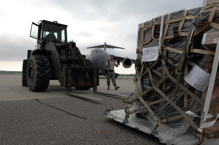 U.S. Air Force Airmen of the 437th Aerial Port Squadron, 437th Air Base Wing, Air Mobility Command, move cargo during an Operational Readiness Inspection at the Combat Readiness Training Center Aug. 5th, 2008, Alpena, Mich. (U.S. Air Force photo by Staff Sgt. Shawn Weismiller) 