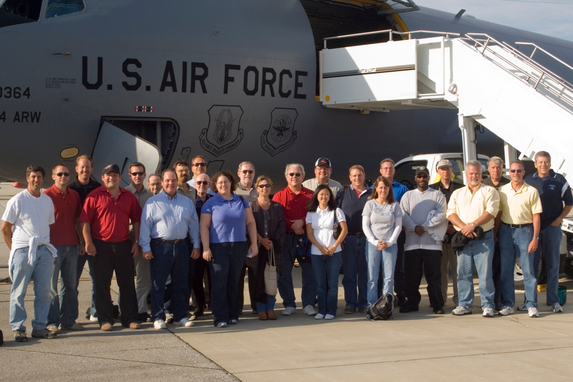 GRISSOM AIR RESERVE BASE, Ind., -- Civic leaders from the Indianapolis area pose in front of the KC-135R Stratotanker they are about to board for a civic leader orientation flight on Aug. 6. The group witnessed aerial refuelings with F-16 Fighting Falcons. (U.S. Air Force photo/Master Sgt. Rob Hoffman)