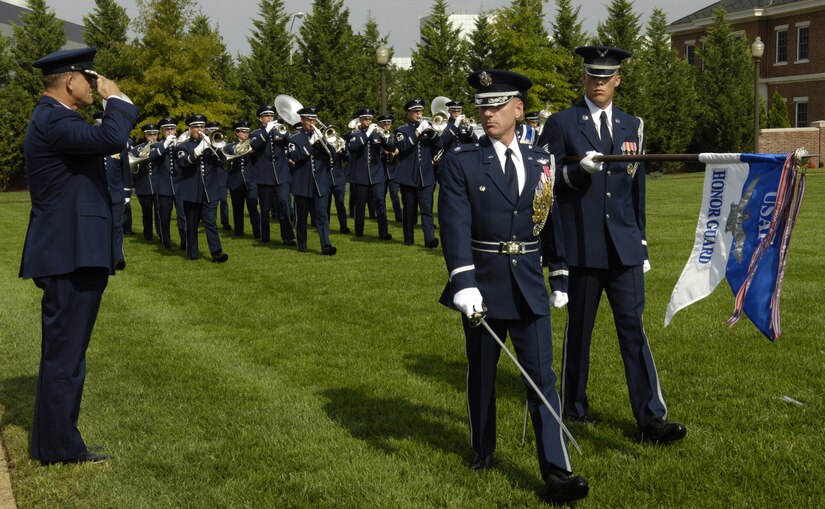 Lt. Col. Anthony Taylor, U.S. Air Force Honor Guard commander, leads the U.S. Air Force Band and Honor Guard in pass in review for Maj. Gen. Frank Gorenc, who relinquished command of the Air Force District of Washington during a ceremony Aug. 6 the U. S. Air Force Ceremonial Lawn on Bolling. General Gorenc is replaced by Maj. Gen. Ralph Jodice II. (U.S. Air Force photo by Senior Airman Dan DeCook)