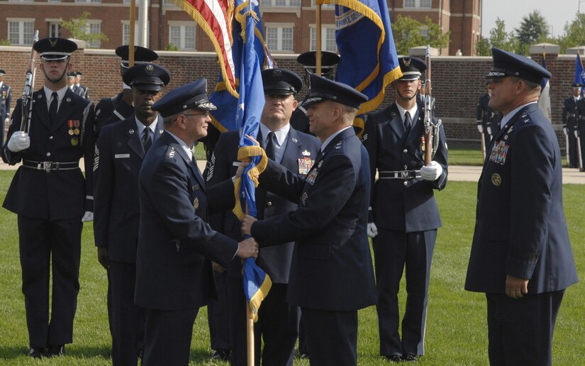 Gen. Duncan J. McNabb (left), Air Force vice chief of staff, hands the Air Force District of Washington guidon to Maj. Gen. Ralph Jodice II, Air Force District of Washington commander, signifying the change of command Aug. 6 on the U. S. Air Force Ceremonial Lawn on Bolling. General Jodice is taking command from Maj. Gen. Frank Gorenc, who will be assigned to Air and Space Operations, Headquarters Air Combat Command, Langley Air Force Base, Va.  (U.S. Air Force photo by Senior Airman Steven Doty)