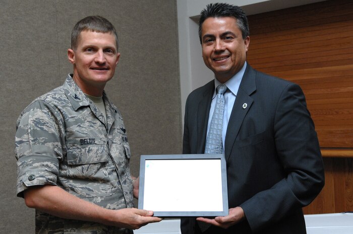 NELLIS AIR FORCE BASE, Nev. -- Colonel David Belote, 99th Air Base Wing commander, recieves an award from Wayne Nastri, President of the Environment Protection Agency, at the Officer's Club, here, July 31, 2008. Nellis was accepted in the the EPA's National Performance Track program in May 2008. (U.S. Air Force photo by Airman First Class Brett C. Clashman)