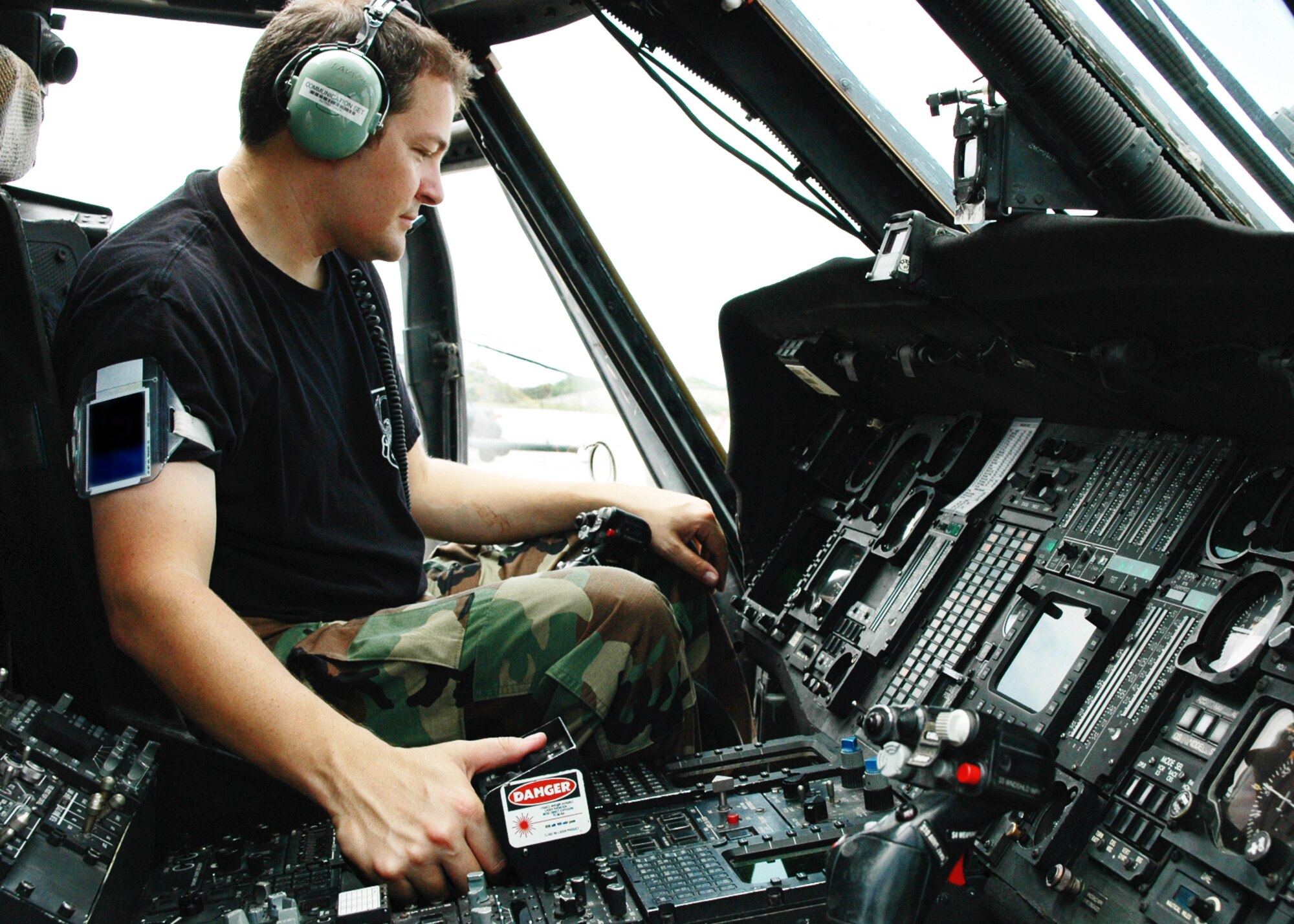 PATRICK AIR FORCE BASE, Fla. -- Air Force Reserve Senior Airman John Fusco, 920th Rescue Wing communications/navigation apprentice, performs a function check on one of the unit's HH60G Pave Hawk helicopters Aug. 3. The Pave Hawks, pararescuemen and HC-130P/N refuelers are used by the 920th for combat and civil search and rescue, humanitarian relief and emergency medical and resuce support of all NASA rocket and space-shuttle launches (U.S. Air Force photo/Master Sgt. Bryan Ripple)