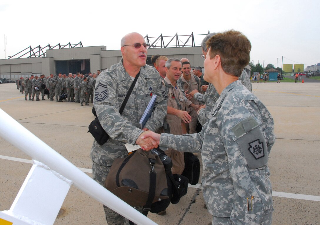 Maj. Gen. Jessica L. Wright, Adjutant General of the Pa. National Guard, bids farewell to Senior Master Sgt. Frank L. Rabena, Jr., 111th Aircraft Maintenance Sq. and approx. 160 guardsmen heading to Afghanistan from the 111th Fighter Wing, Willow Grove Air Reserve Station, Pa. July 27 in support of the continuing war on terrorism.