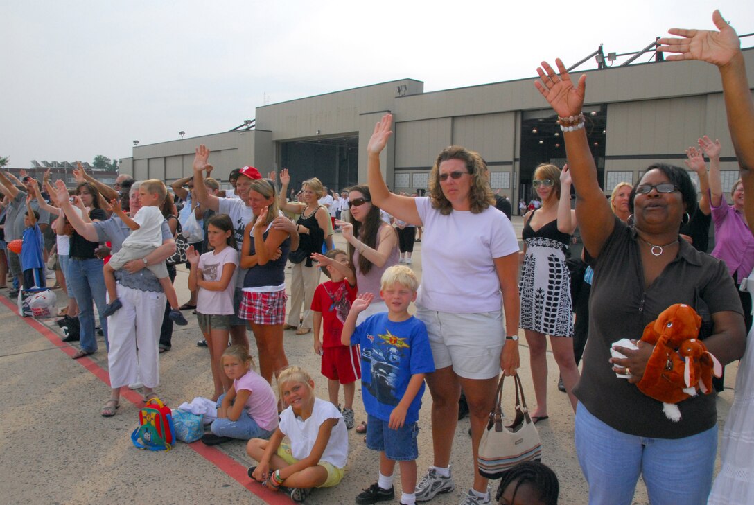 Family and friends wave goodbye to approx. 160 guardsmen from the 111th Fighter Wing, Pa. Air National Guard, as they board an aircraft from the Willow Grove Air Reserve Station, Pa. headed for Afghanistan to support the continuing war on terrorism July 27.