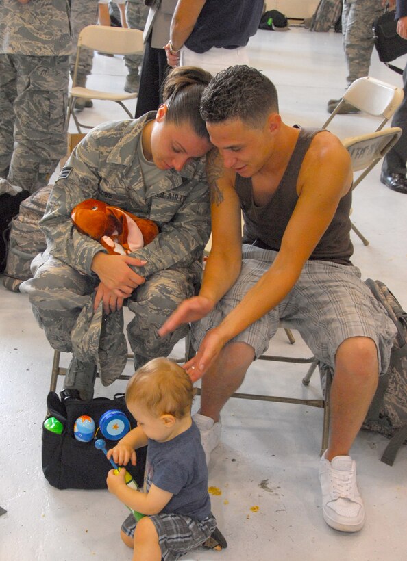 Senior Airman Megan T. Cobb, 111th Logistics Readiness Sq. spends her last moments with family before deploying with 160 guardsmen to Afghanistan from the 111th Fighter Wing, Pa. Air National Guard, Willow Grove Air Reserve Station, Pa. July 27 to support the continuing war on terrorism.