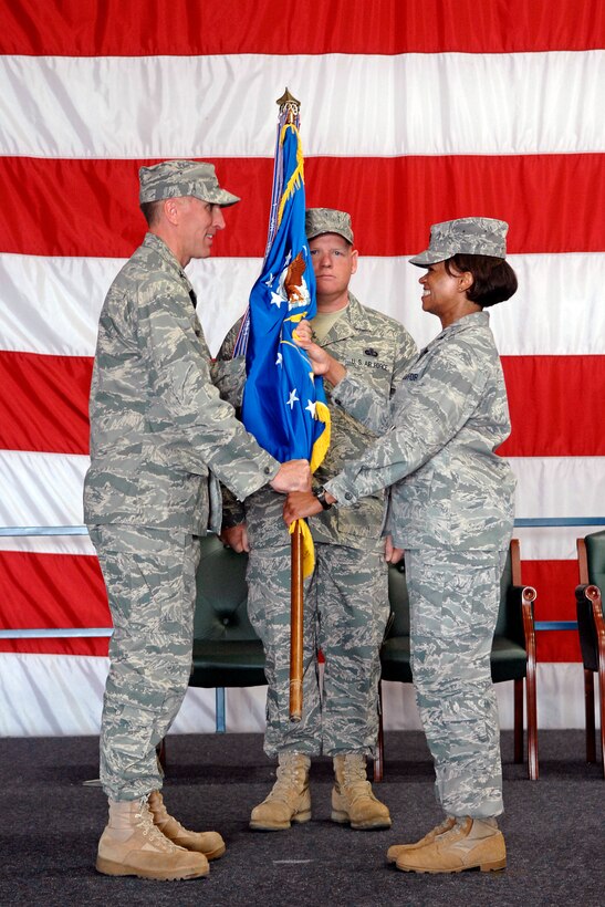 (Right) Col. Renita Alexander relinquishes her command of the 28th Mission Support Group to Col. Scott Vander Hamm, 28th Bomb Wing commander, in Dock 33, Aug. 1. The 28 MSG supports more than 16,000 active-duty members, dependents, Department of Defense civilians and military retirees living in the Rapid City area. Colonel Alexander is retiring after nearly 27 years in active-duty service. (U.S. Air Force photo/Senior Airman Marc I. Lane)