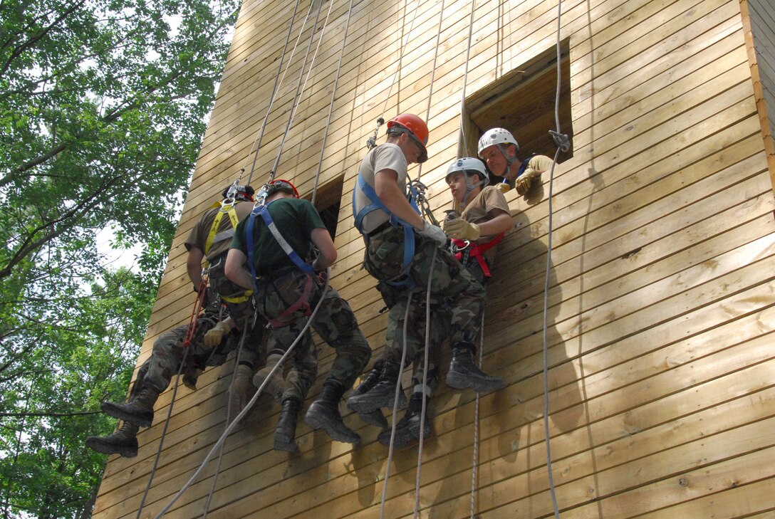 Tech. Sgt. Matthew P. Youngers and Staff Sgt. Matthew C. Haas, both of the 111th Maintenance Sq., Pa. Air National Guard, conduct a one person rescue called a 'pick off' with Team Commanders Course students at the Hawk Mountain Ranger School in Kempton, Pa. on July 17.  