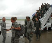 MINOT AIR FORCE BASE, N.D. -- Chief Master Sgt. Mark Clark, 5th Bomb Wing command chief master sergeant, greets Warbirds Aug, 2 returning from Red Flag at Nellis Air Force, Nev., Red Flag is a two-week, realistic combat training exercise involving the air forces of the United States and its allies. (U.S. Air Force photo by Airman 1st Class Wesley Wright)