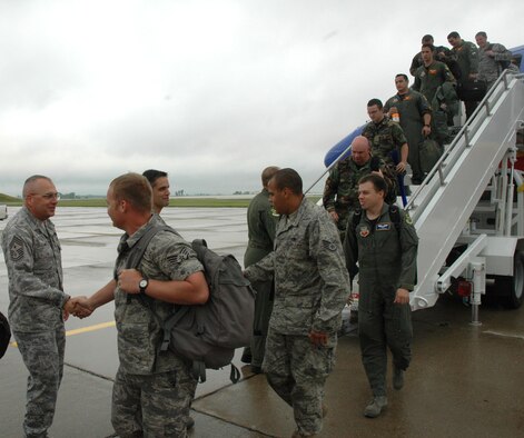 MINOT AIR FORCE BASE, N.D. -- Chief Master Sgt. Mark Clark, 5th Bomb Wing command chief master sergeant, greets Warbirds Aug. 2 returning from Red Flag 08-03 at Nellis Air Force, Nev. Red Flag is a two-week, realistic combat training exercise involving the air forces of the United States and its allies. (U.S. Air Force photo by Airman 1st Class Wesley Wright) 