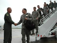 MINOT AIR FORCE BASE, N.D. -- Col. Joel Westa, 5th Bomb Wing commander, greets Warbirds Aug, 2 returning from Red Flag at Nellis Air Force, Nev., Red Flag is a two-week, realistic combat training exercise involving the air forces of the United States and its allies. (U.S. Air Force photo by Airman 1st Class Wesley Wright)