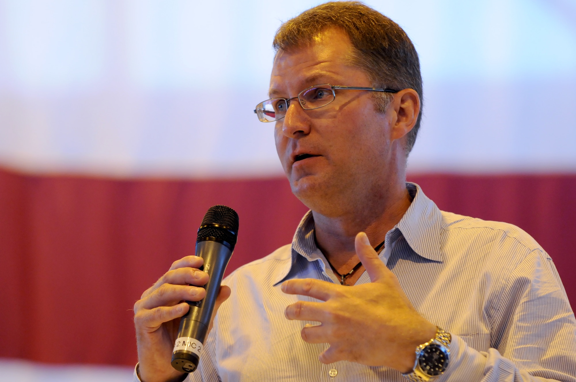 Dave Pelzer speaks to the Airmen of the 86th Airlift Wing during a commander's call Aug. 8, 2008, Ramstein Air Base, Germany. As a Former Air Force air crewmember, Mr. Pelzer played a major role in mid-air refueling of the once highly secretive SR-71 Blackbird and the F-117 Stealth Fighter, but is best known for his six inspirational books that have been on the best sellers list for over 13 years combined. (U.S. Air Force photo by Airman 1st Class Nathan Lipscomb)(Released)