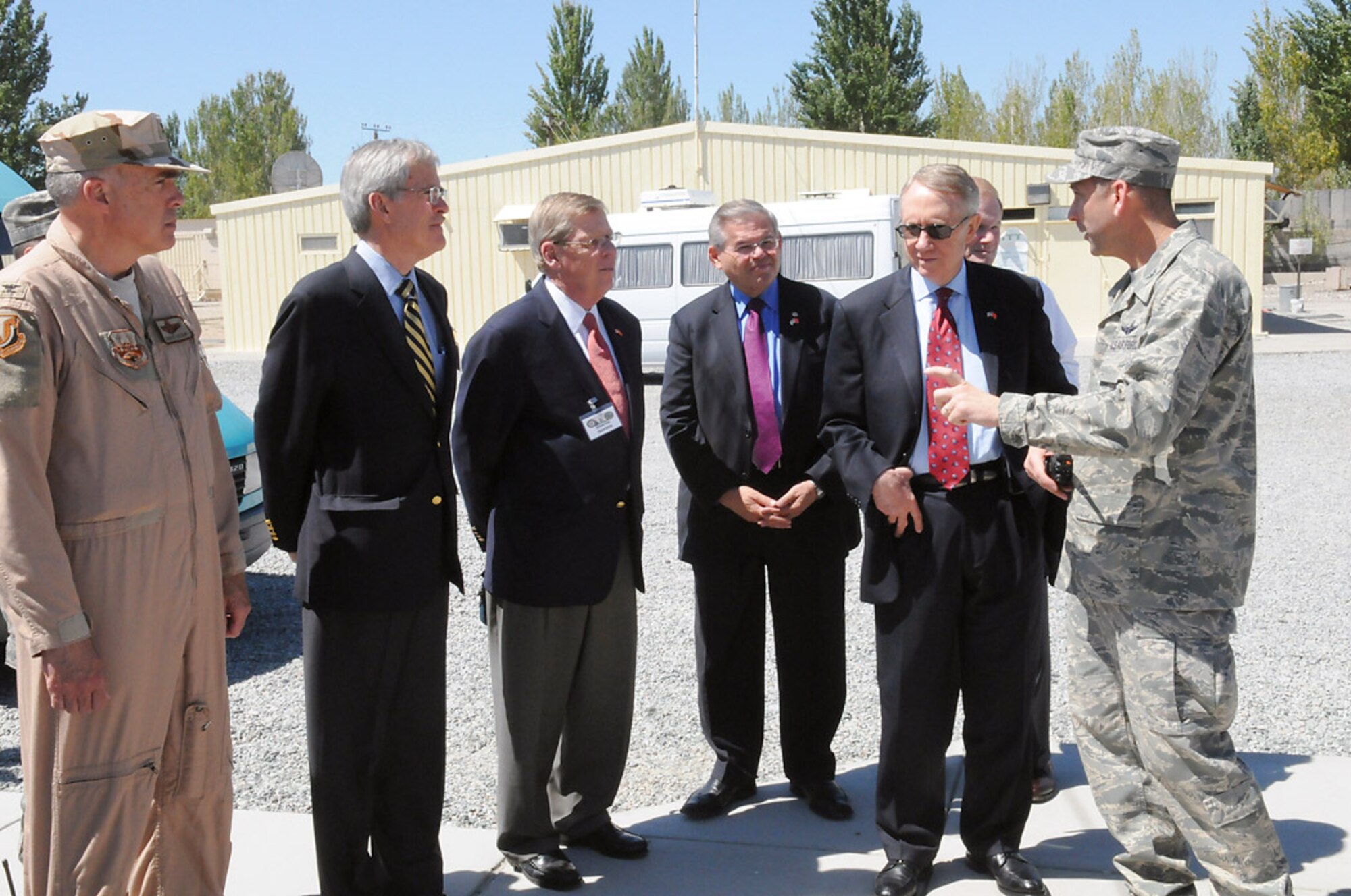 Senators Jeff Bingaman, Johnny Isakson, Robert Menendez, Harry Reid and Bill Nelson are briefed by Col. Christopher Bence, 376th Air Expeditionary Wing commander, about the wing's mission as an air mobility hub supporting operations in Afghanistan. The senators visited the base Aug. 5 as a part of an eight-day congressional delegation trip to promote security, democracy and development in central Asia. While at Manas, the senators met with deployed Airmen and learned about the missions they carry out. (U.S. Air Force photo/Airman 1st Class Ruthann Holcomb) 
