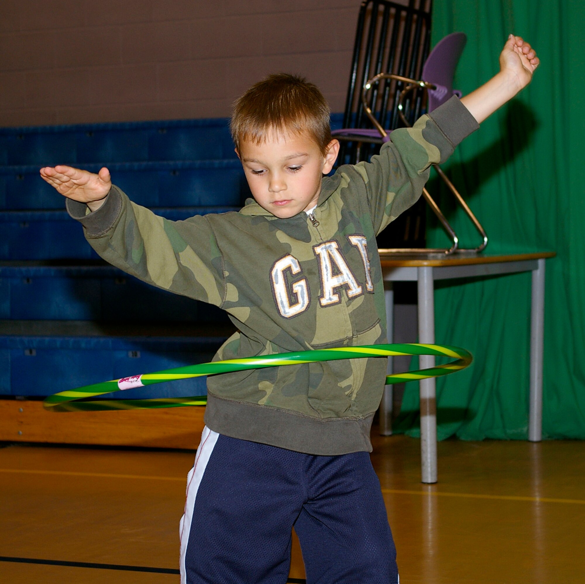 Michael Ciardelli, 6, shows off his skills on the hula hoop during a circuit class for 5- and 6-year olds at the RAF Mildenhall Youth Center Aug. 1. The 100th Force Support Squadron put together the mini-circuit class to provide extra ways to keep children entertained. (U.S. Air Force photo by Karen Abeyasekere) 