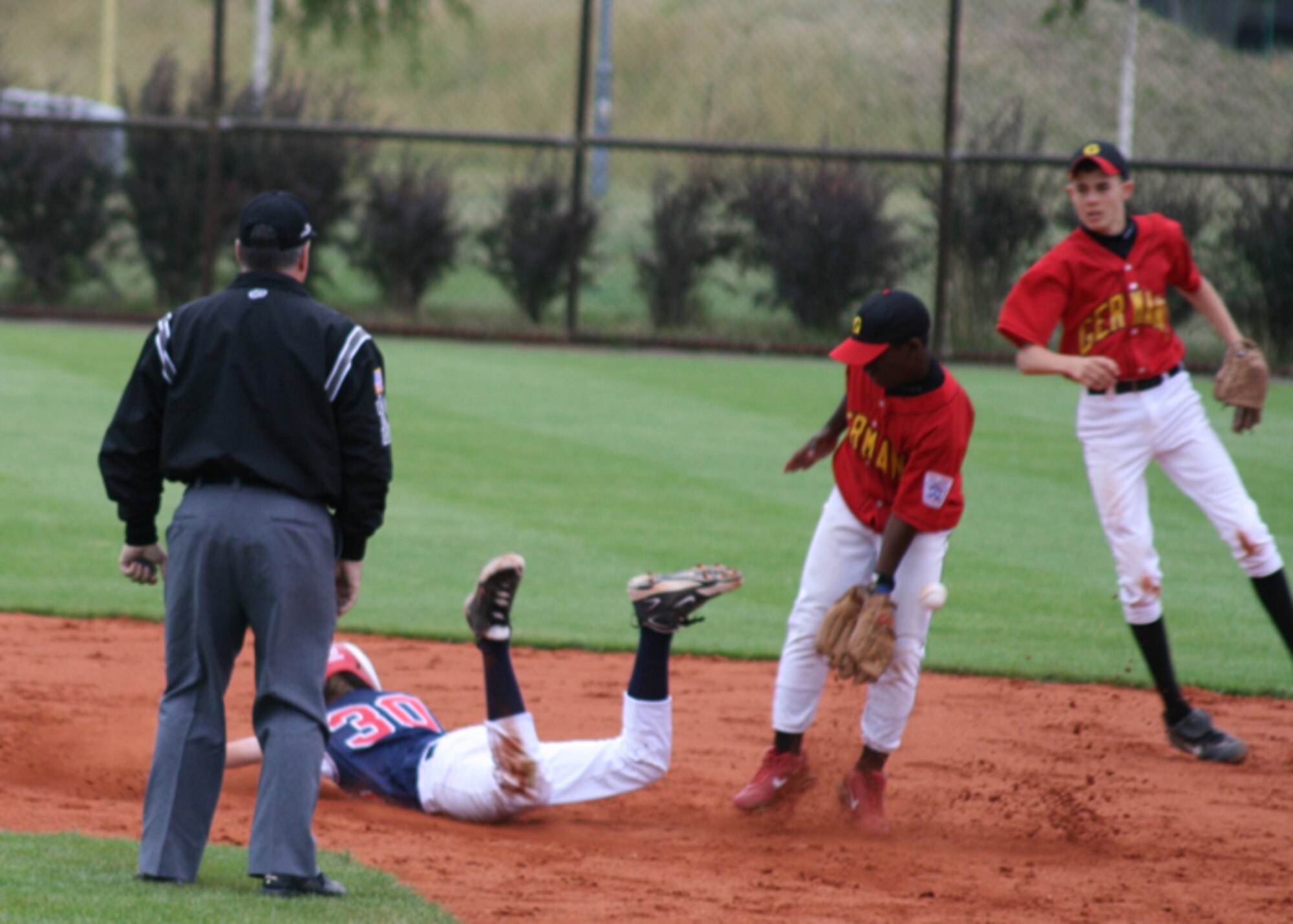Cody Warner, right fielder, 14, dives onto the base for a clean "safe!" call. Cody and five other teammates will represent Europe in the 2008 Junior League World Series in Taylor, Mich. (Courtesy photo)