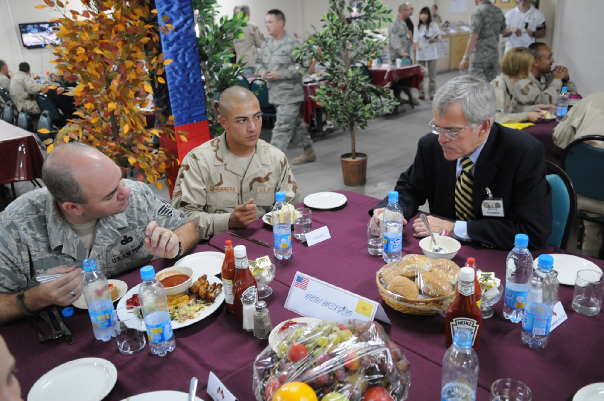 MANAS AIR BASE, KYRGYZ REPUBLIC -- Sen. Jeff Bingaman talks with Master Sgt. Ken Clark, a Las Cruces, N.M. native, and Airman 1st Class Christopher Deherrera, who is deployed from Holloman Air Force Base, N.M. The New Mexico senator and four others visited Manas, Aug. 5, as a part of an eight-day congressional delegation trip to promote security, democracy and development in central Asia. While at Manas, the senators visited with deployed Airmen and learned about the wing's mission as the premier air mobility hub supporting operations in Afghanistan. (Air Force photo / Airman 1st Class Ruthann Holcomb)