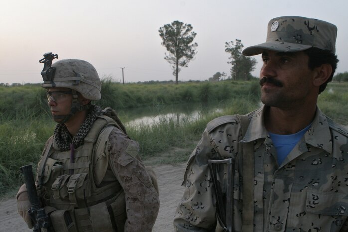 Marines patrol Helmand Province with Afghanistan National Border Patrolmen, helping familiarize both them with the region and the local populace with interacting with the ANBP.