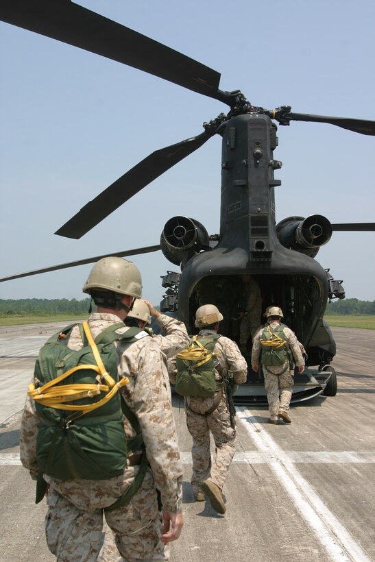 Marines with U.S. Marine Corps Forces, Special Operations Command enter the MH-47D Chinook helicopter from the Army’s 160th Special Operations Aviation Regiment at Drop Zone Pheasant here, August 6.