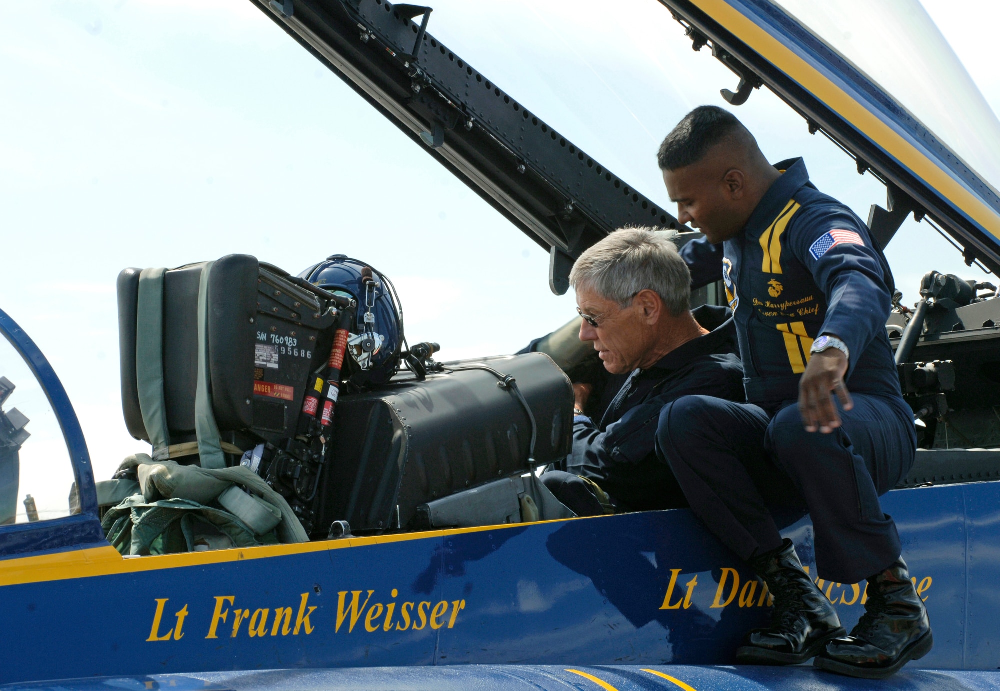 FAIRCHILD AIR FORCE BASE, Wash. – U.S. Marine Corps Staff Sgt. Deo Harrypersaud, number seven crew chief and crew chief supervisor, prepares George Dennison, president of the University of Montana, for his ride in a Navy Blue Angels F/A-18 Hornet here Aug. 7.  (U.S. Air Force photo / Airman 1st Class Joshua K. Chapman)