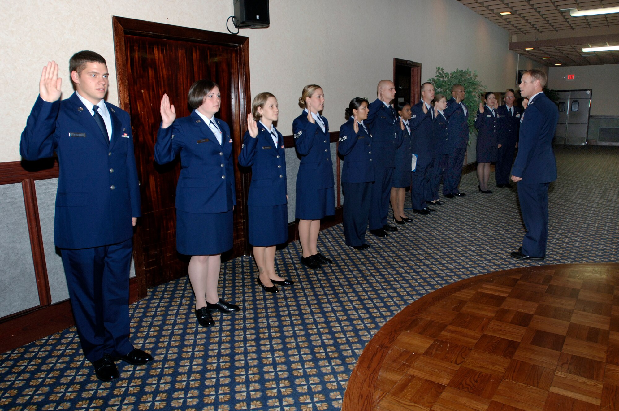 FAIRCHILD AIR FORCE BASE, Wash.-- Col. Blaine Holt, 92nd Air Refueling Wing vice commander, administers the oath of enlistment to 15 promotees during a wing promotion ceremony at Club Fairchild July 30. (U.S. Air Force photo / Airman 1st Class Melissa Barnett)