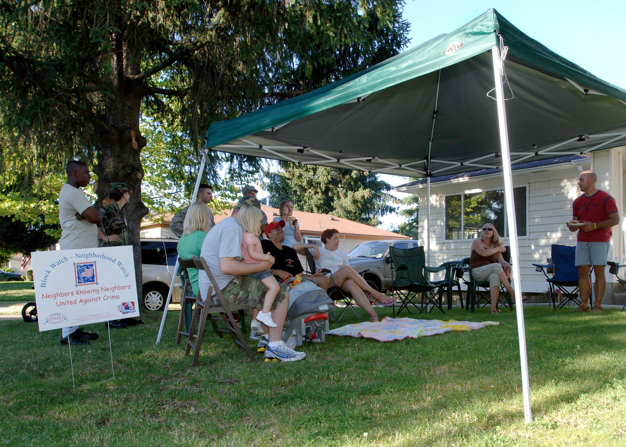 FAIRCHILD AIR FORCE BASE, Wash.  – Staff Sgt. Jeromy Frisk, 92nd Security Forces Squadron, non-commissioned officer in charge police services, hosts National Night Out at his home Aug. 5. Friends and neighbors gathered to combat drug and crime prevention in their communities and educate on home safety. (U.S. Air Force photo / Airman 1st Class Melissa Barnett)