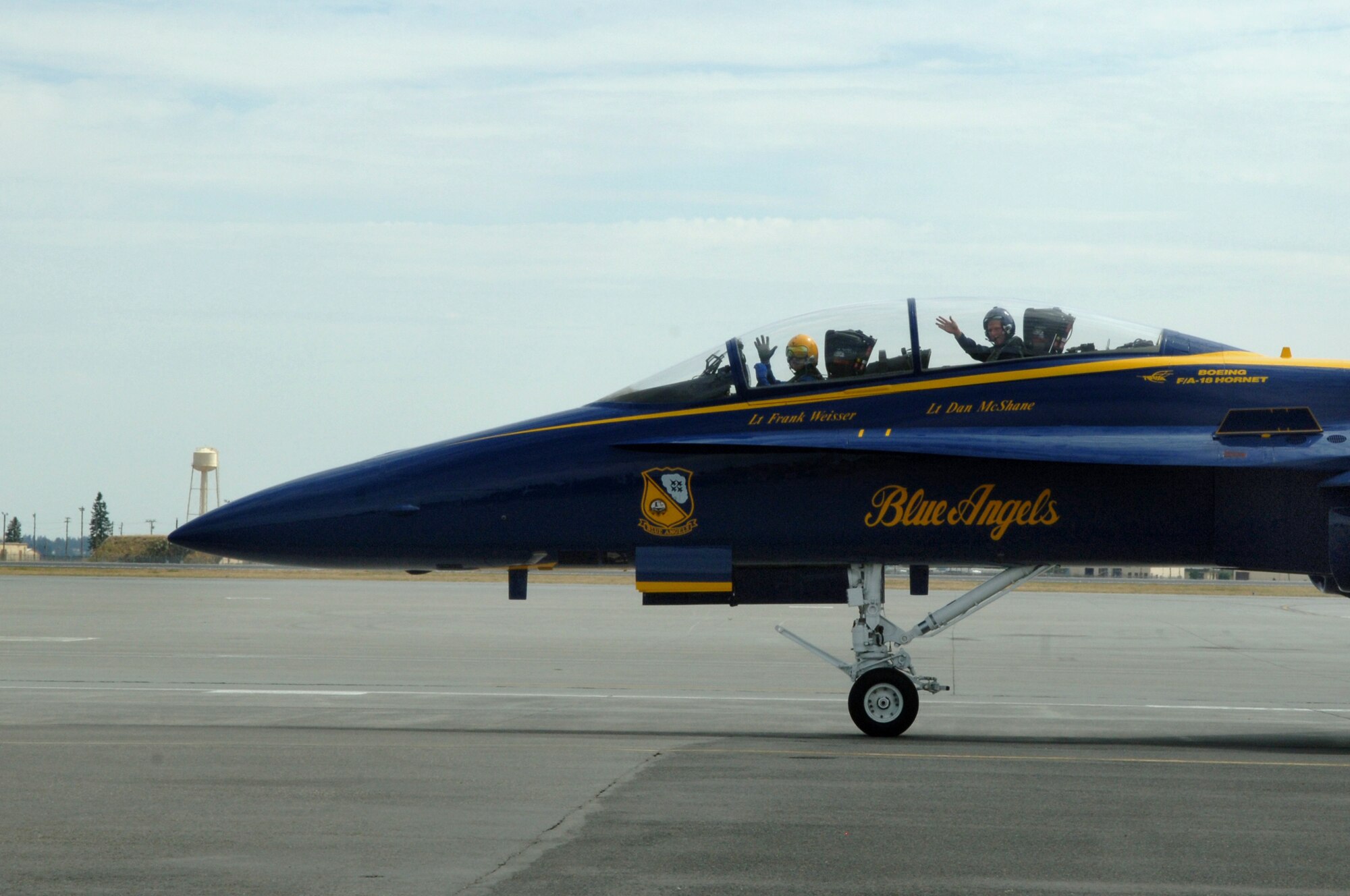 FAIRCHILD AIR FORCE BASE, Wash. – A large part of the Blue Angel's mission is recruiting, and this year’s incentive riders were chosen based on their high level of influence over recruitable age men and women. Here, Mark Few, Gonzaga University men’s basketball team head coach, waves from the second seat of the F/A – 18 Hornet Aug. 6, piloted by Navy Lt. Frank Weisser. (U.S. Air Force photo / Senior Airman Jocelyn A. Ford)