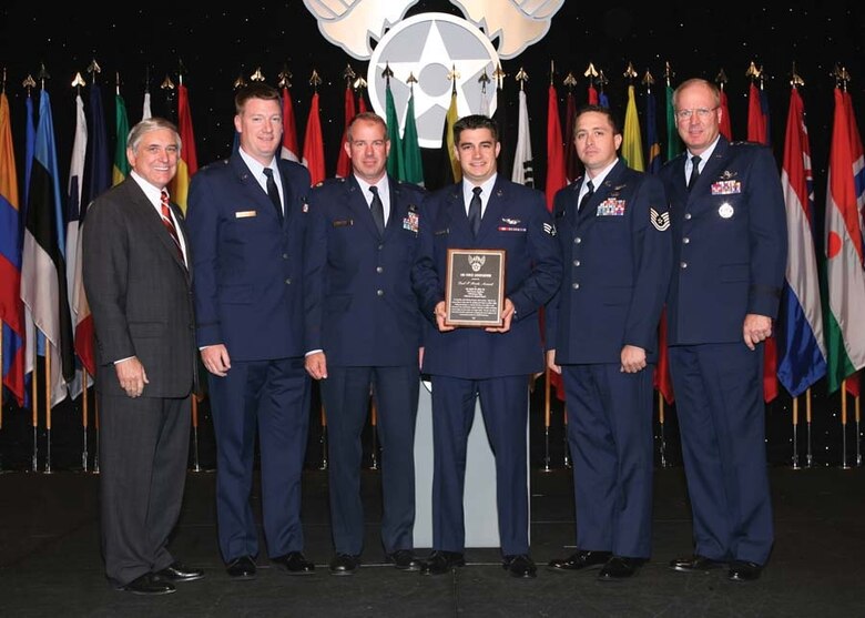 Air Force Association Chairman Robert Largent (left) and Lieutenant General Craig McKinley, Director Air National Guard (far right) present the Earl T. Ricks award for Outstanding Airmanship to the crew of Jolly 92; Pilots Capt. Matt Redmond, Major Tom Keegan, Door Gunner Senior Airman Sean Pellaton and Flight Engineer Tech. Sgt. Trey Hicks at the Annual Air Force Association awards banquet in Washington D.C. Sept. 24, 2007. (Photo courtesy of Air Force Association)