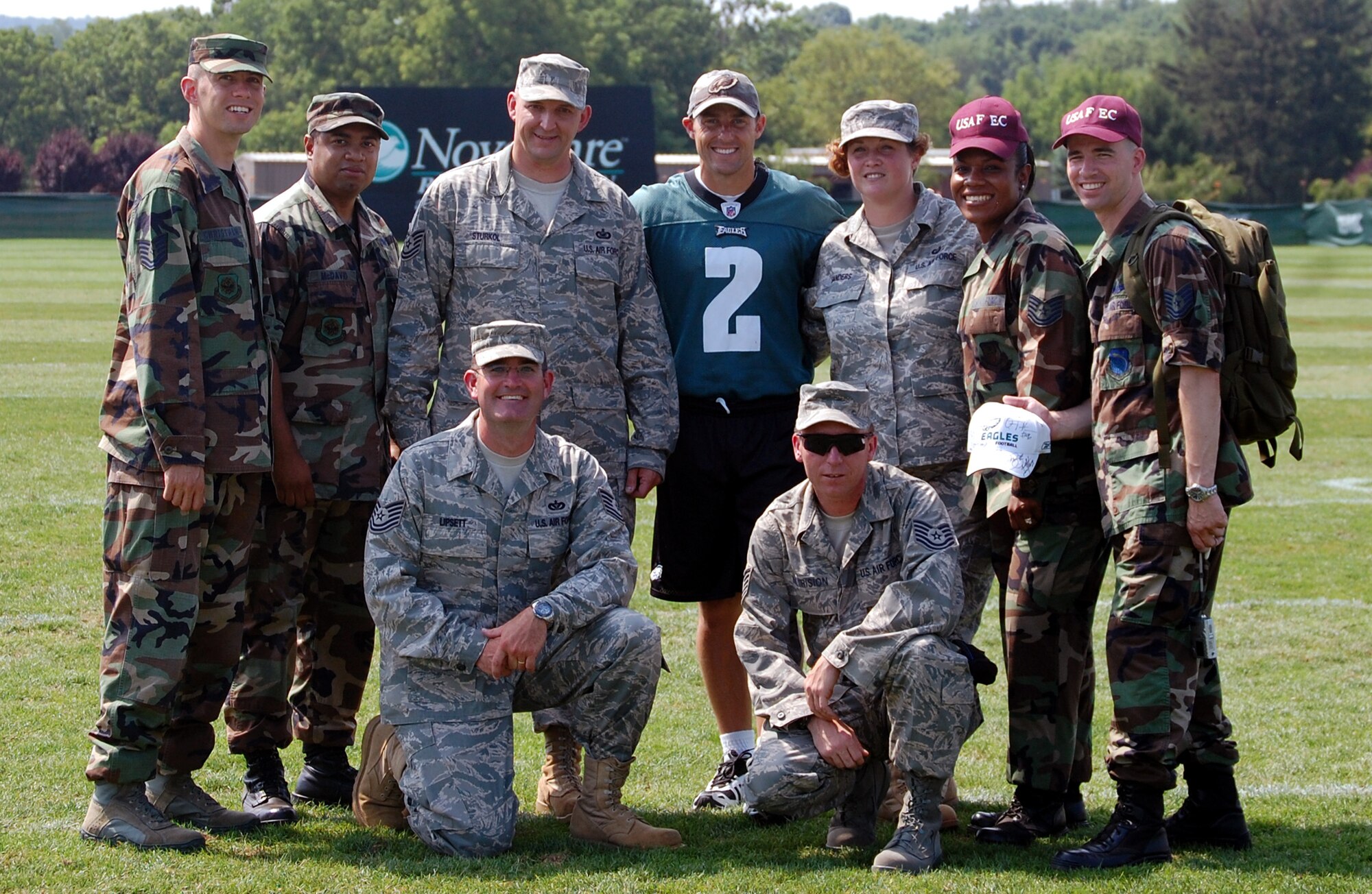 This group photo shows those Airmen from the U.S. Air Force Expeditionary Center at Fort Dix, N.J., attending the Philadelphia Eagles training camp Military Day at Lehigh University in Lehigh, Penn., Aug. 5, 2008, as pictured with Eagles kicker David Akers (center).  Pictured are: (first row kneeling) Tech. Sgts. William Lipsett and Robert Metrision; (second row from left) Tech. Sgt. Zachary Christman, Staff Sgt. Veuril McDavid, Tech. Sgt. Scott Sturkol, Eagles kicker David Akers, Tech. Sgt. Christine Sanders, Tech. Sgt. Angie Caballero and Tech. Sgt. Chris Sherman.  (U.S. Air Force Photo)