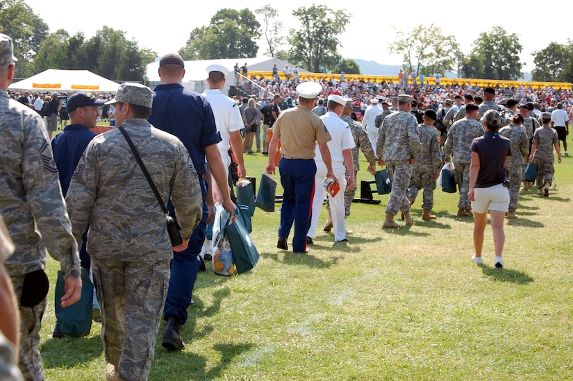 More than 200 military members walk out to the practice field during a visit to the Philadelphia Eagles training camp at Lehigh University in Lehigh, Penn., Aug. 5, 2008.  During the event, military members from all services were treated to breakfast and had a meet and greet with Eagles staff and players.  (U.S. Air Force Photo/Tech. Sgt. Scott T. Sturkol)