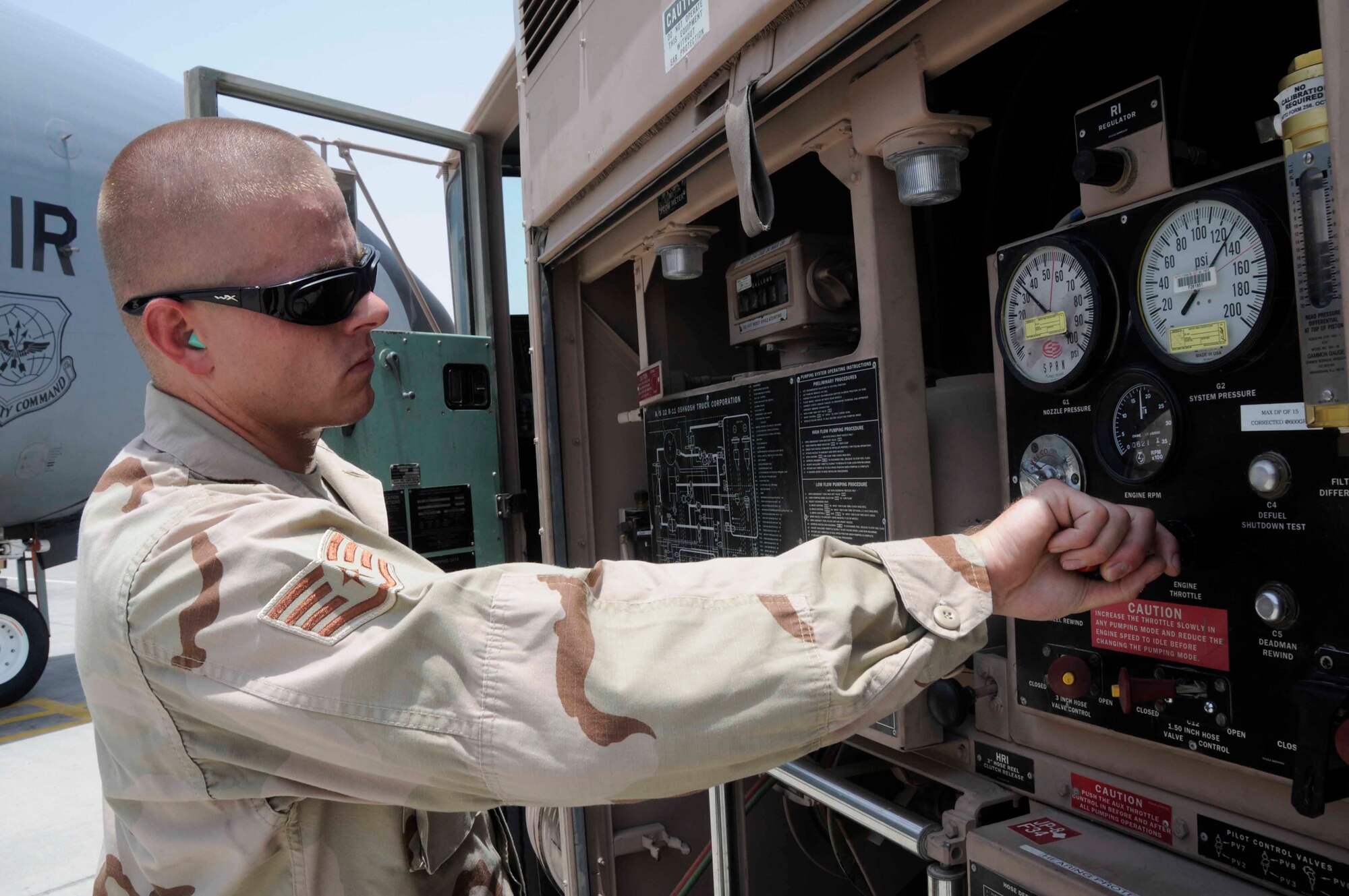 Staff Sgt. Marcus Ortman monitors the differential pressure meter July 24 at a Southwest Asian air base. Sergeant Ortman is assigned to the 379th Expeditionary Logistics Readiness Squadron and deployed from McChord Air Force Base, Wash. (U.S. Air Force photo/Staff Sgt. Darnell T. Cannady) 
