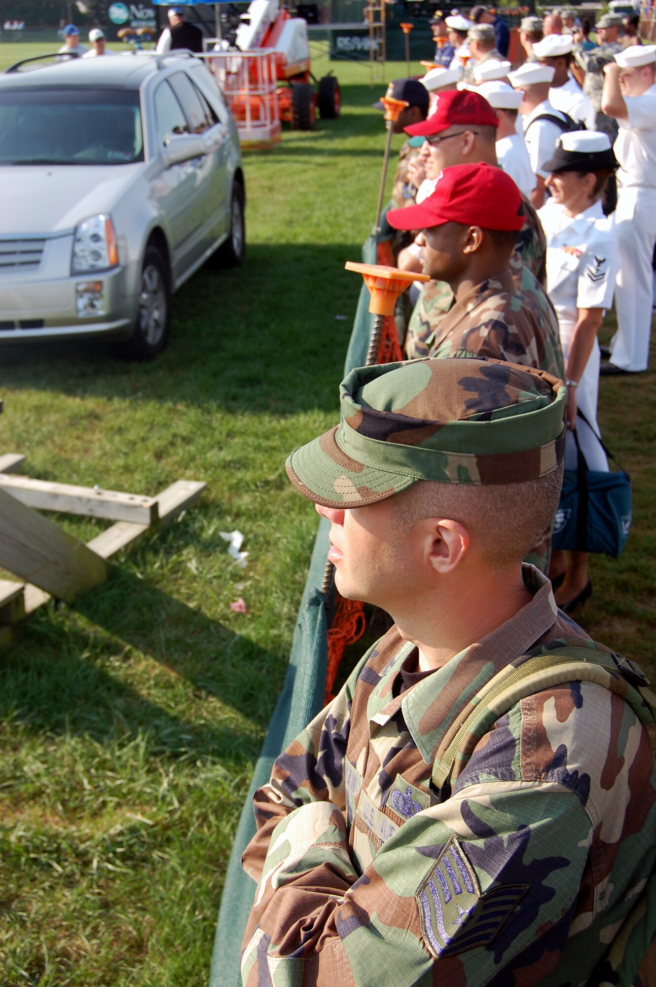Airmen, Sailors and other military members watch the National Football League's Philadelphia Eagles practice on a field at Lehigh University in Lehigh, Penn., Aug. 5, 2008.  The presence of military members In Lehigh was part of the Philadelphia Eagles' Military Day where more than 200 service members took part from all branches of service.  (U.S. Air Force Photo/Tech. Sgt. Scott T. Sturkol)