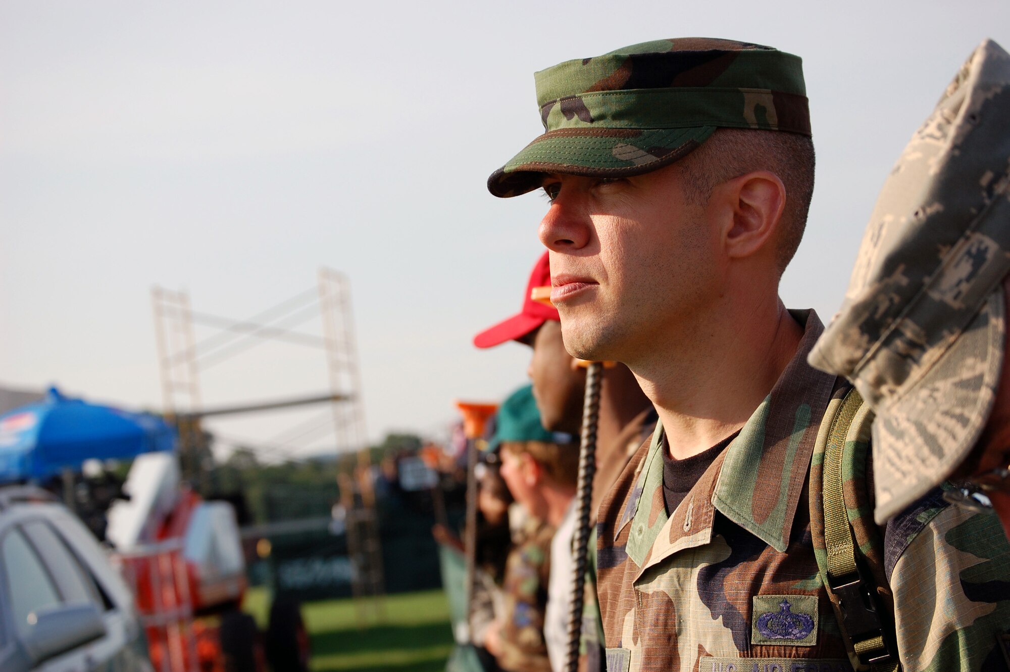 Tech. Sgt. Zachary Christman, from the U.S. Air Force Expeditionary Center at Fort Dix, N.J., along with oher military members, watches the National Football League's Philadelphia Eagles practice on a field at Lehigh University in Lehigh, Penn., Aug. 5, 2008.  The presence of military members In Lehigh was part of the Philadelphia Eagles' Military Day at training camp where more than 200 service members took part from all branches of service.  (U.S. Air Force Photo/Tech. Sgt. Scott T. Sturkol)