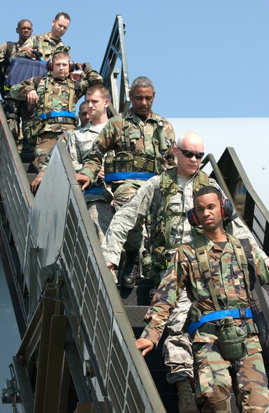 Team Dover members return from their recent deployment to Alpena, Mich., Aug. 1. More than 700 Airmen participated in the week-long operational readiness inspection.(U.S. Air Force photo/Jason Minto)