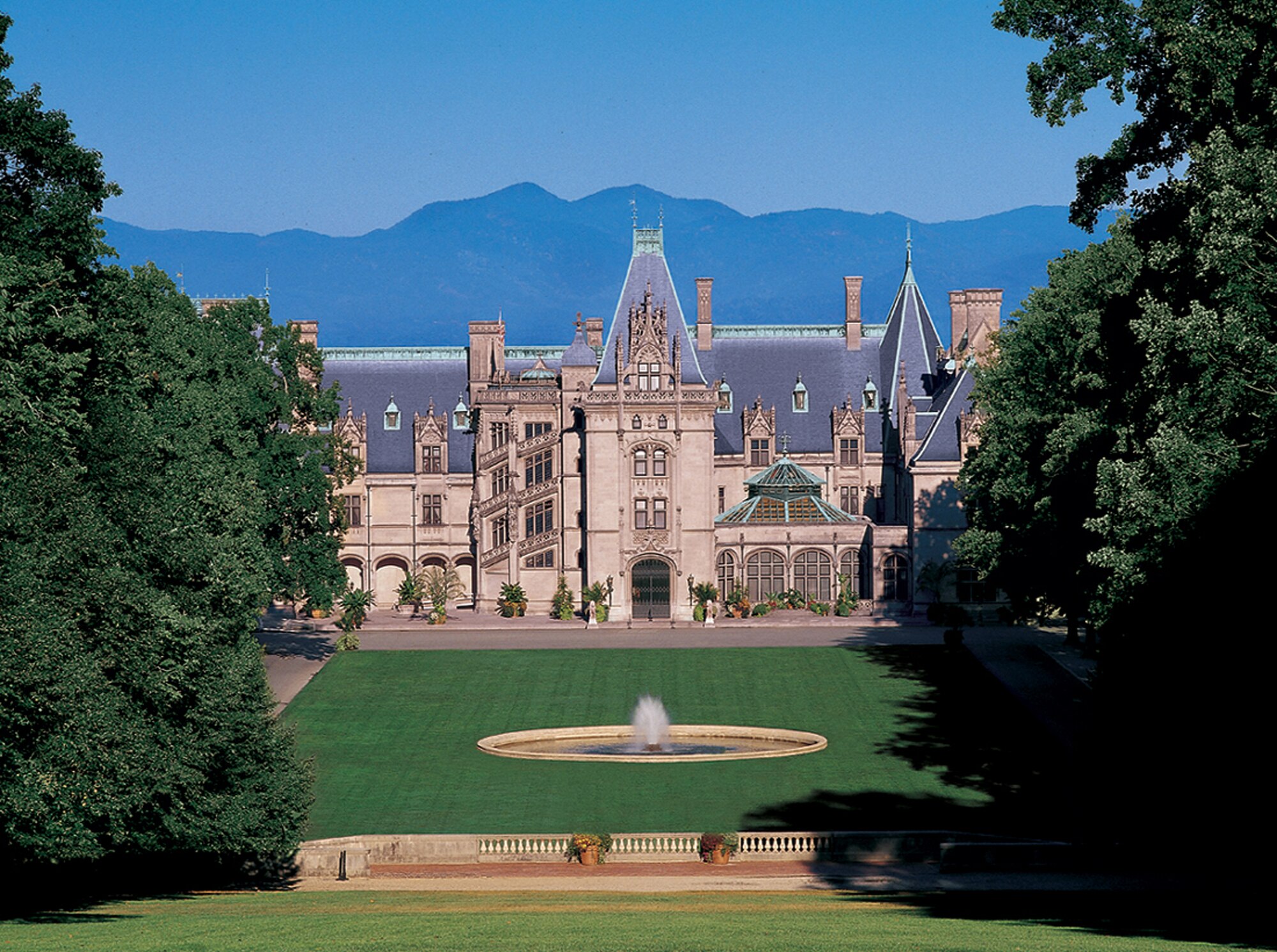 The Biltmore Estate glows against the Blue-Ridge mountains. The estate is open daily for tours, wine-tastings, and hikes. (Courtesy Photo)