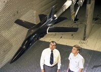 Tom Perkins, left, a supervising engineer with ARO, Inc., discusses an F-111 model installation in Arnold’s 16-foot transonic wind tunnel with Capt. William Tucker, Jr., an Air Force test director at the center when AEDC was conducting wind tunnel tests on NASA’s Advanced Fighter Technology Integration (AFTI-111) program during May 1977. (AEDC file photo)