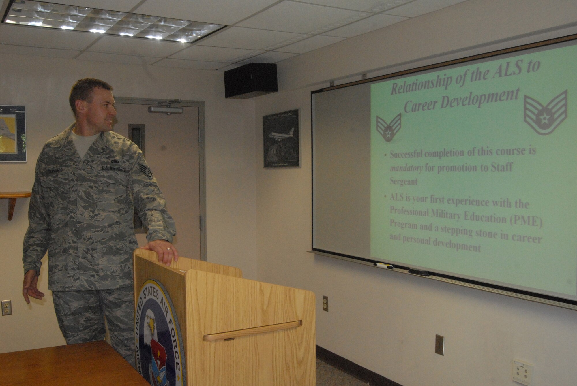 Staff Sgt. Robert Edwards, 43rd Mission Support Squadron, briefs new Airman Leadership School students on school policies, course objectives, the first week’s schedule and the supplies students will need. The newest class of ALS students began the course Aug. 1. (U.S. Air Force Photo by Emily Smith)