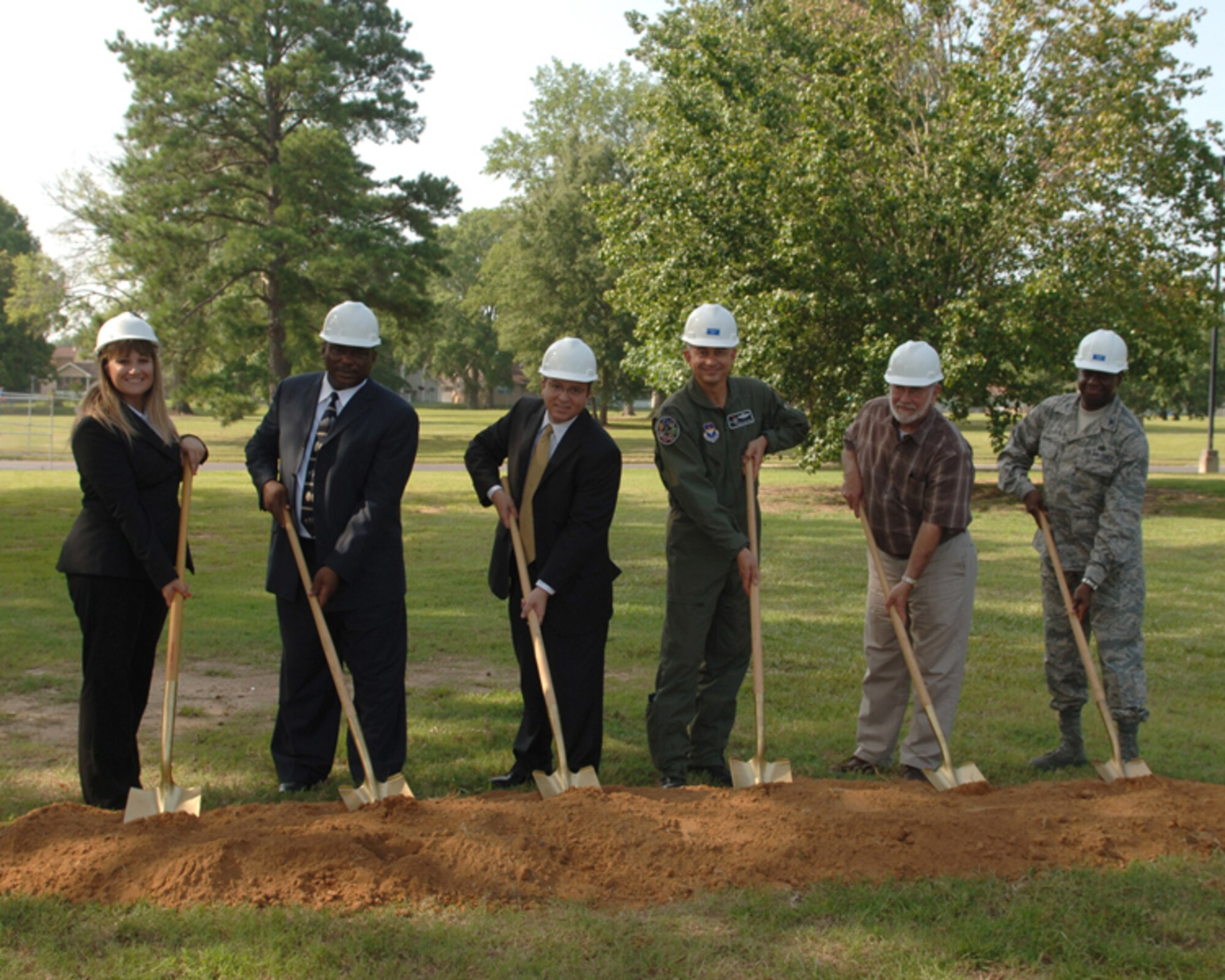 Cassandra Price, Community Director for Pinnacle Columbus AFB, Robert Smith, Mayor of Columbus, Daniel Chavira, Vice President of Hunt Development, Col. Roger Watkins, 14th Flying Training Wing commander, Harry Sanders, President of Lowndes County Board of Supervisors, and Col. Mark Brown, 14th Mission Support Group commander, break ground for new family housing during a ceremony held at Columbus AFB July 29. (U.S. Air Force photo by Elizabeth Owens)